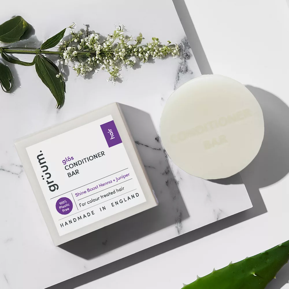 Conditioner bar and box on marble surface.