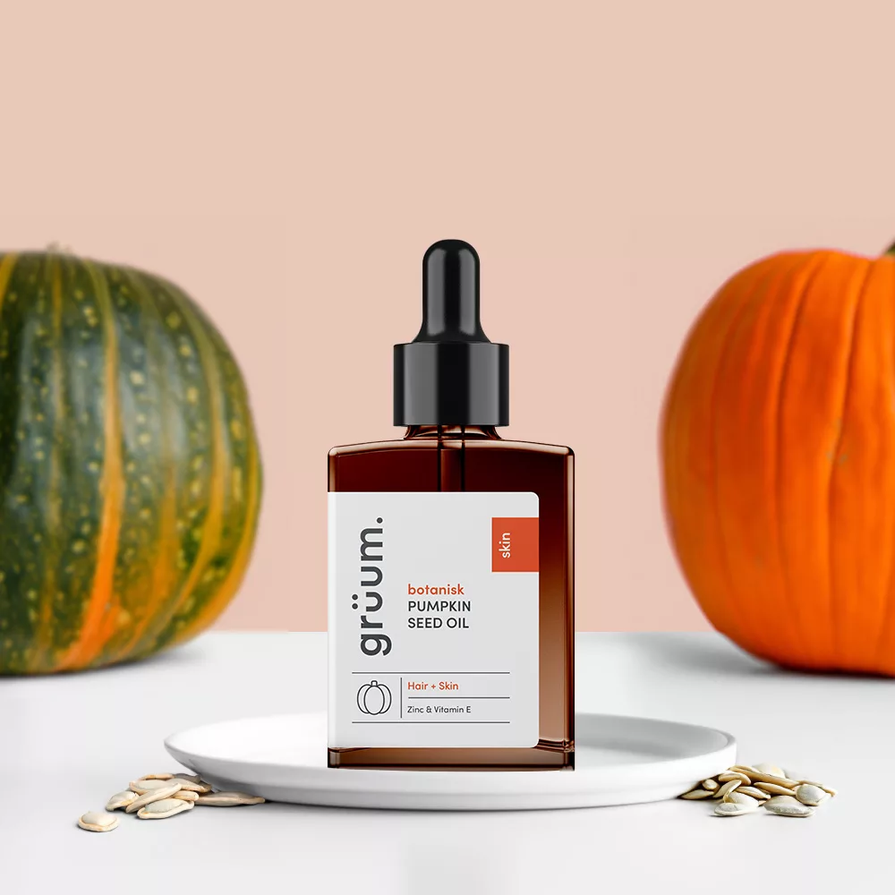 Pumpkin seed oil bottle with pumpkins