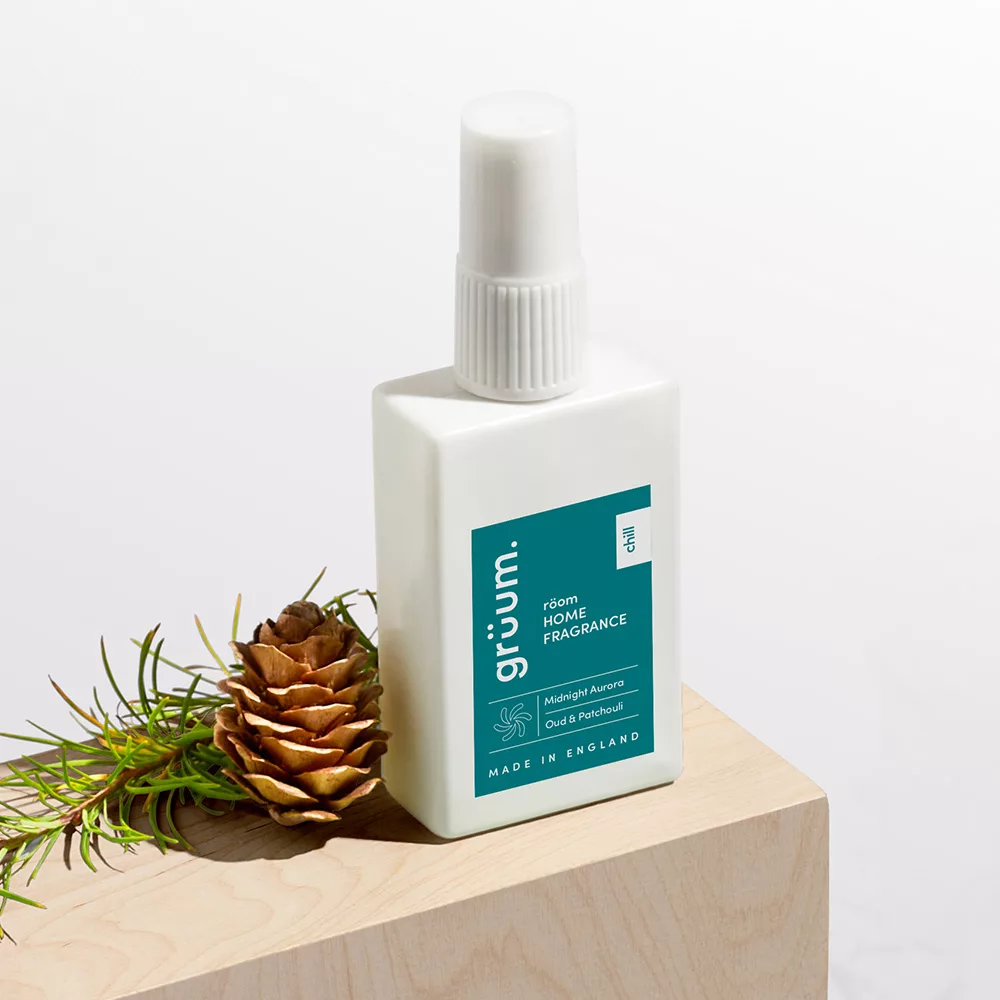 Room fragrance bottle on wood.