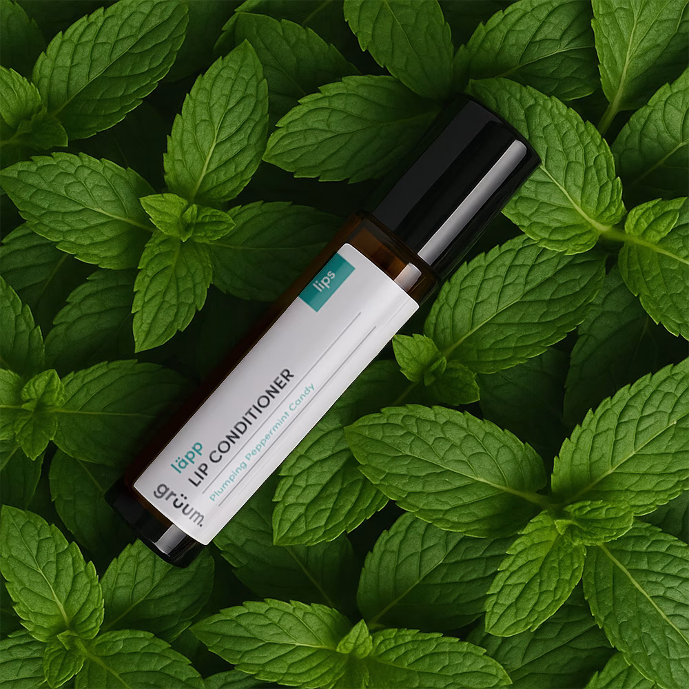 Lip conditioner on mint leaves