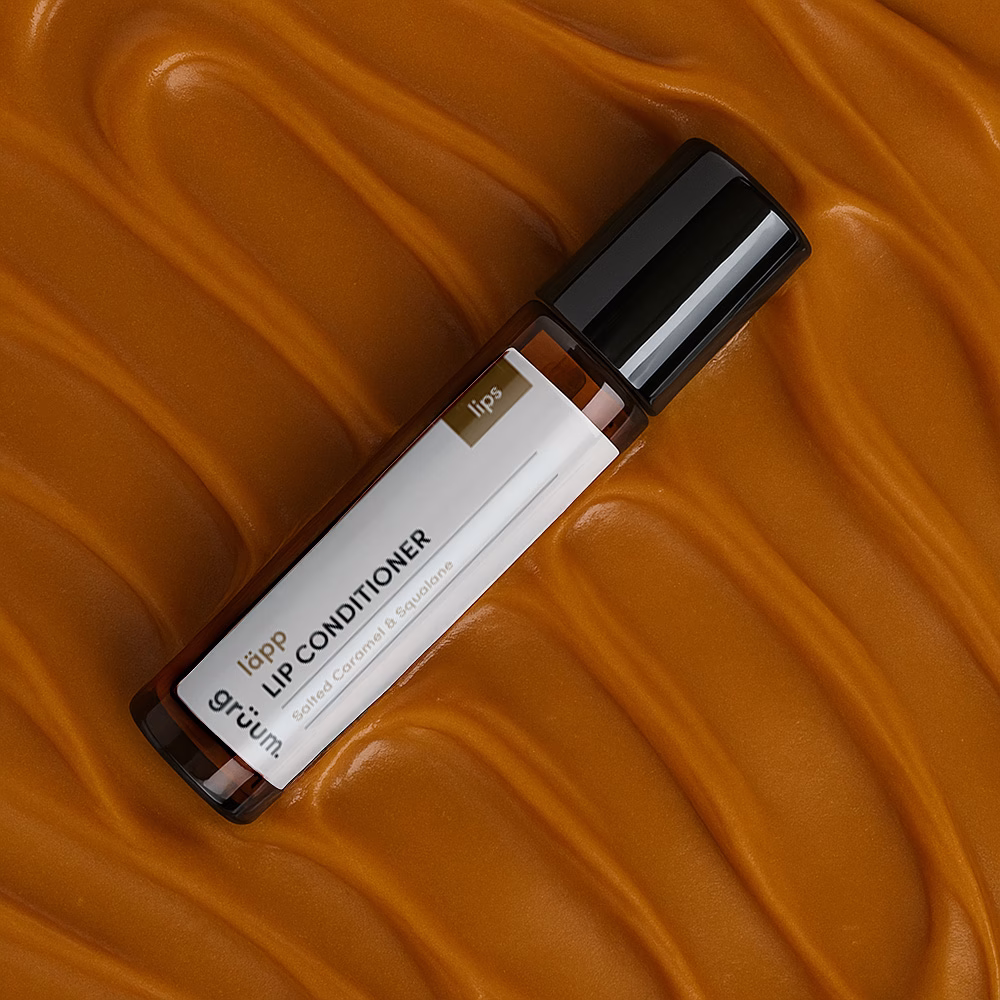 Lip conditioner on caramel background.