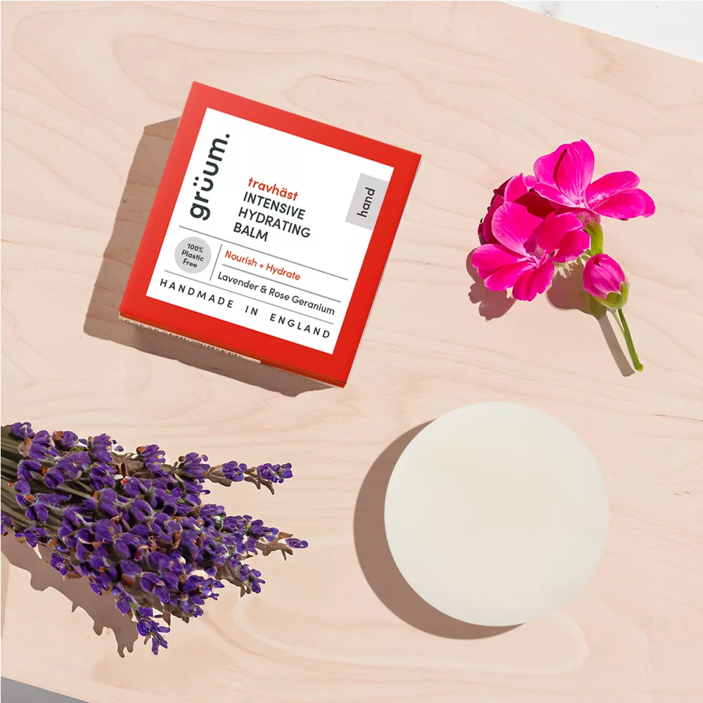 Hydrating balm with flowers on a table.