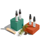 Four spray bottles on colored blocks.