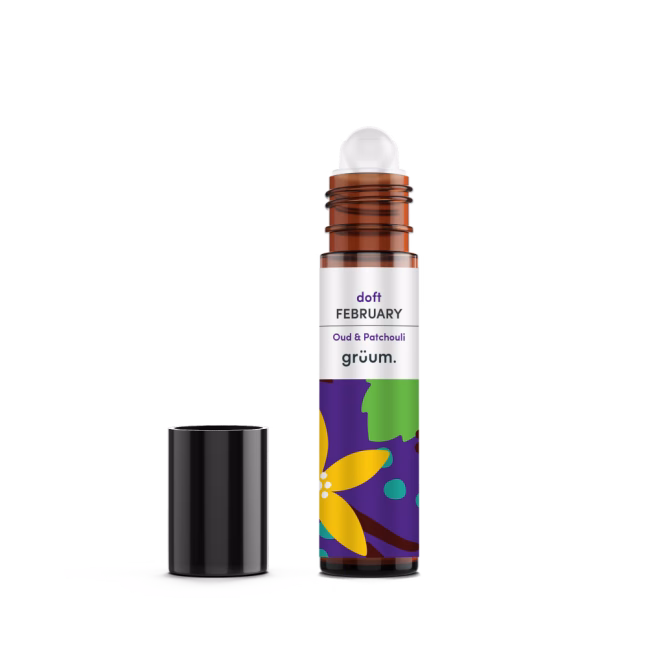 Roll-on perfume bottle with open cap.