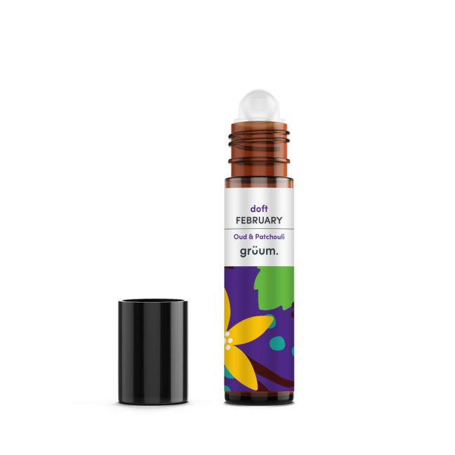 Roll-on perfume bottle with open cap.