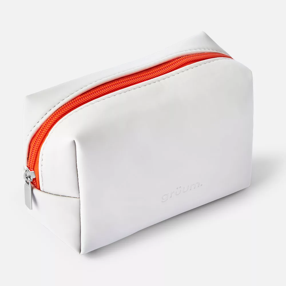 White bag with orange zipper.
