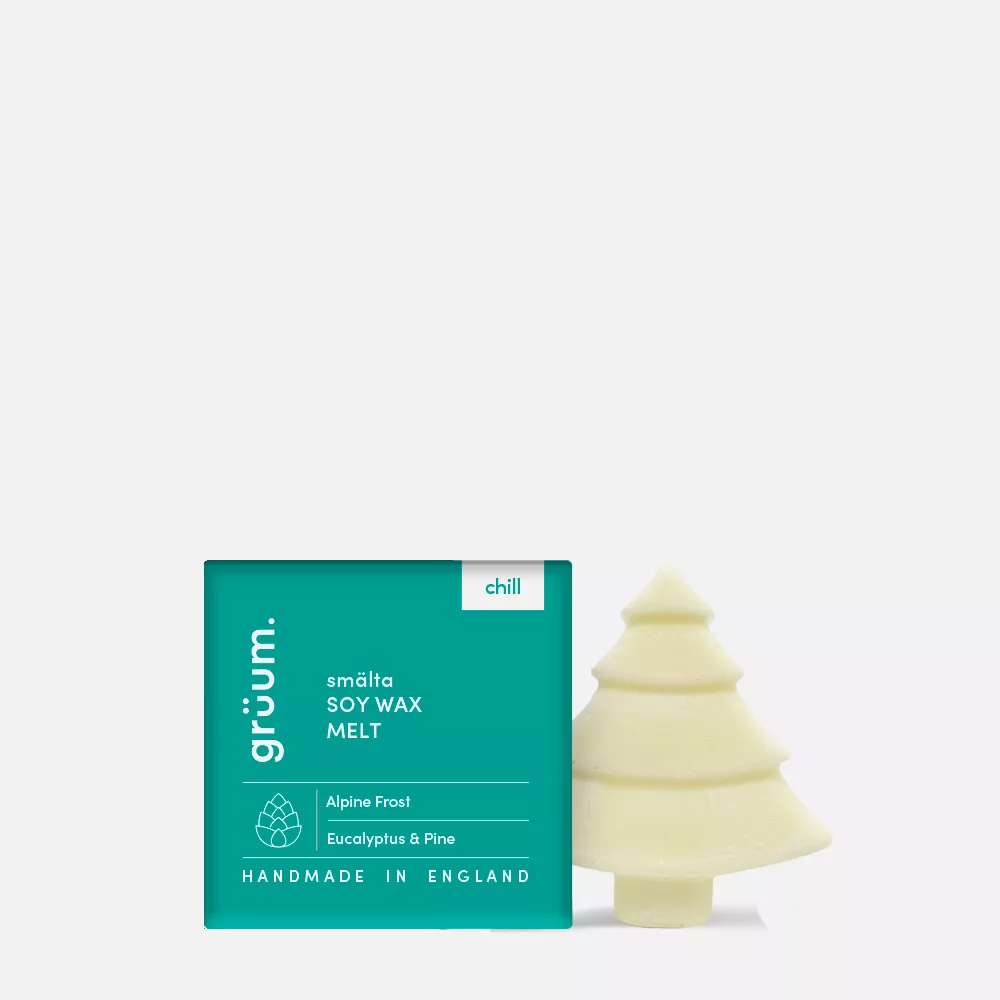 Green package with tree-shaped wax melt.