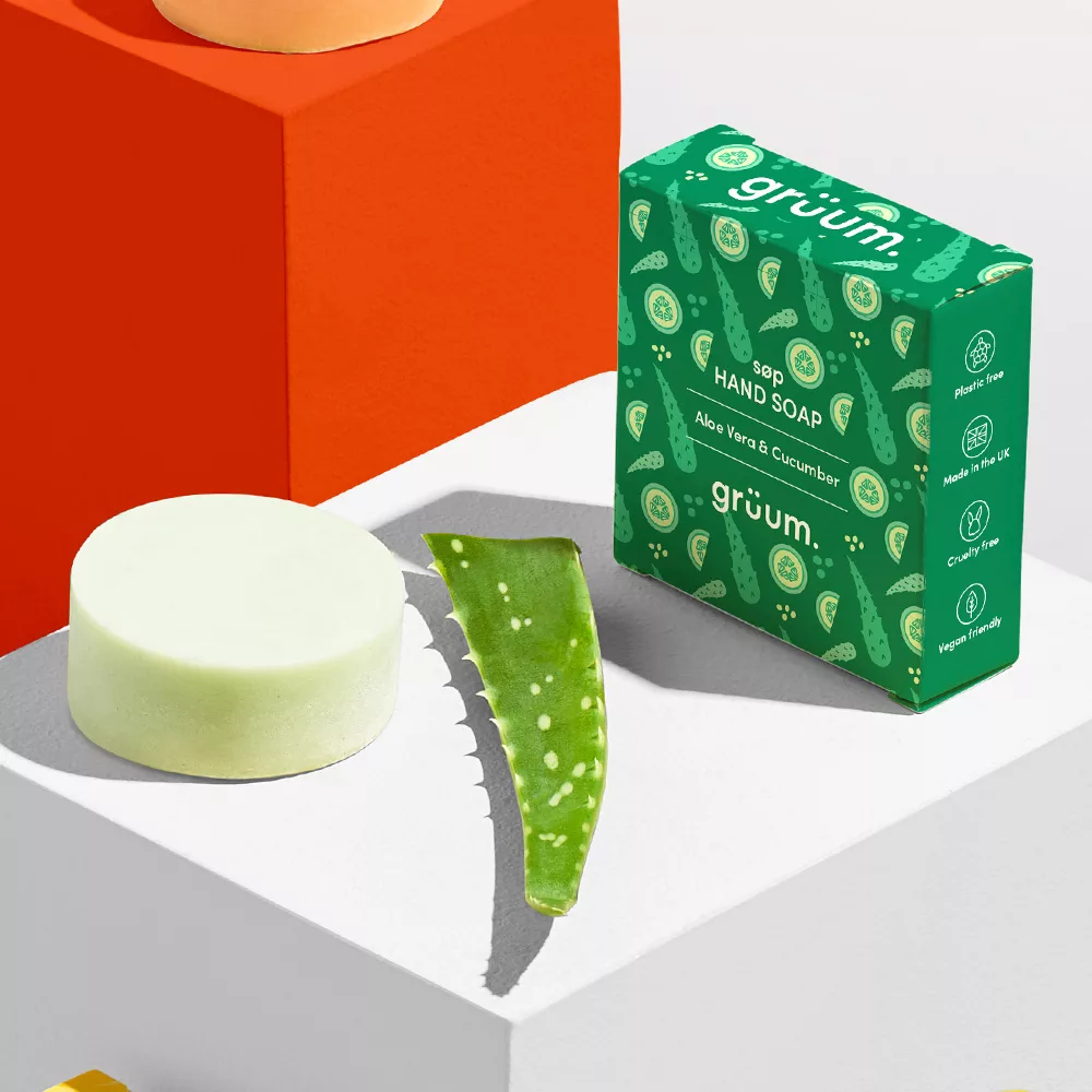 Soap, aloe leaf, and packaging displayed