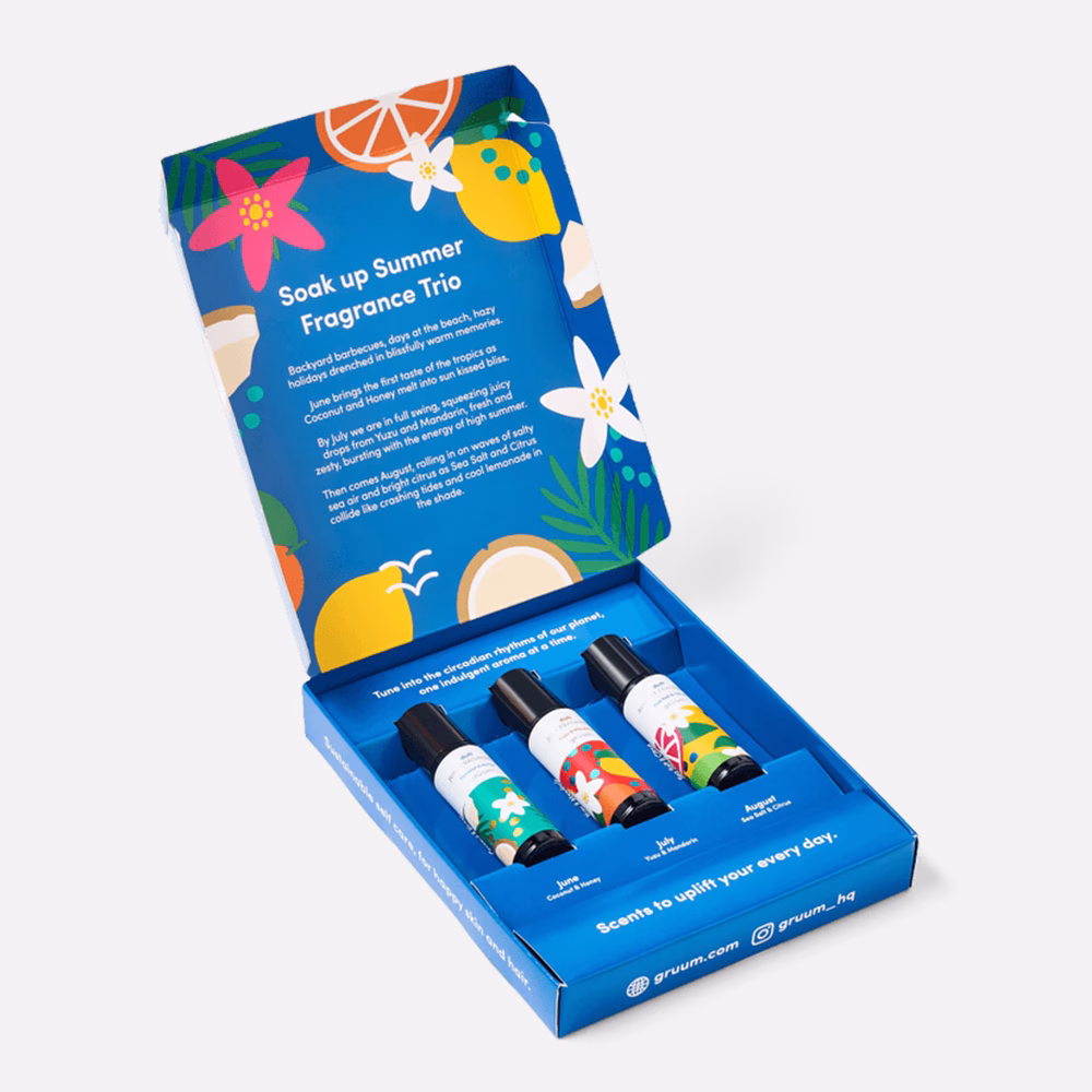 Three fragrance bottles in a blue box.