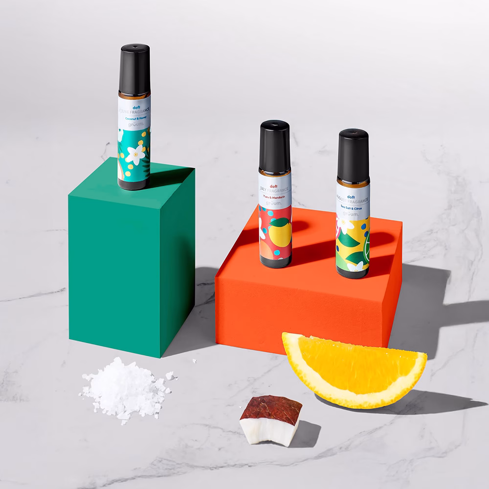 Three perfume bottles on colored blocks