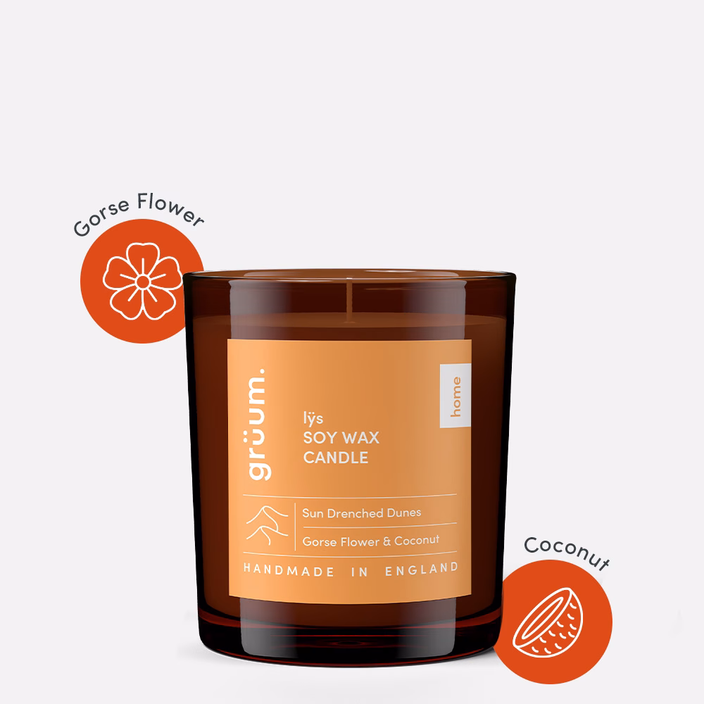 Soy wax candle in brown glass jar.