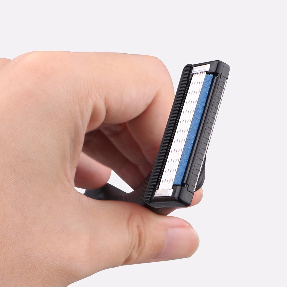 Hand holding a razor blade