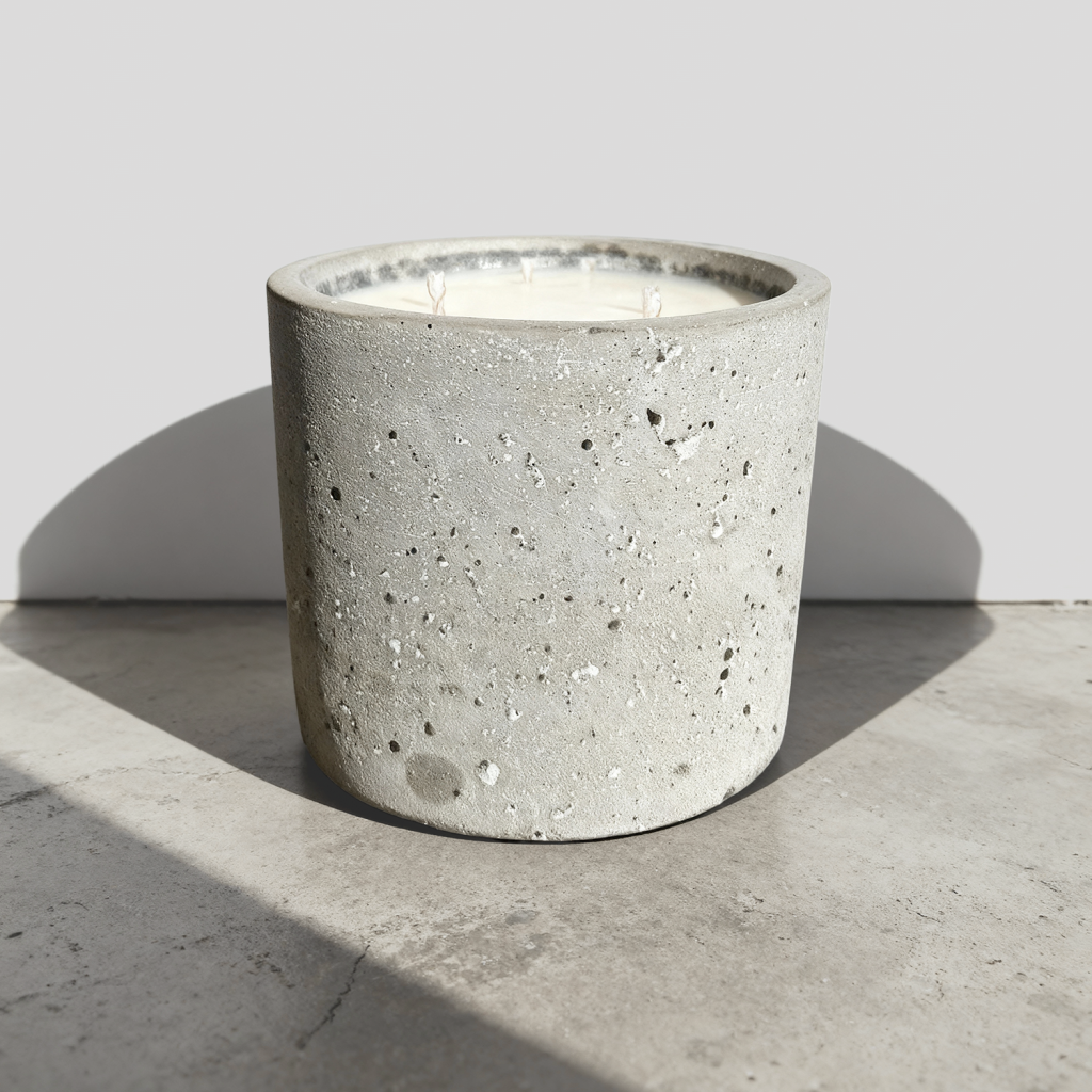 Concrete candle on gray background.