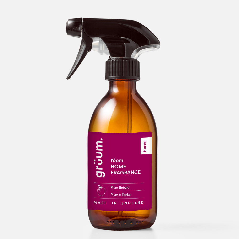 Brown spray bottle with pink label