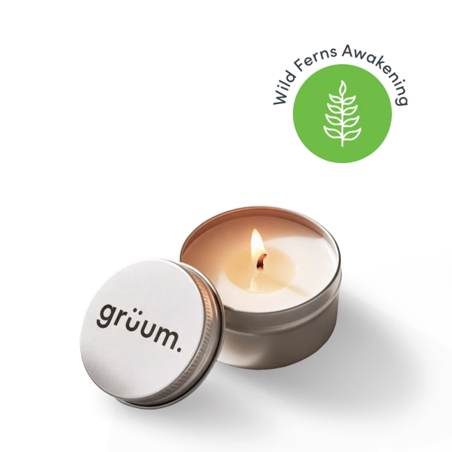 Lit candle with tin lid