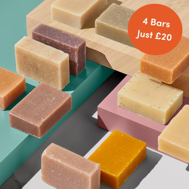 Assorted soap bars on colored blocks.