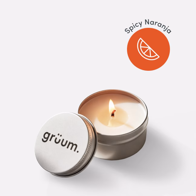 Candle labeled gruum, spicy naranja aroma.