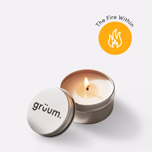 Lit candle with gruum logo