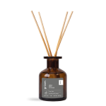 Brown glass reed diffuser with sticks.